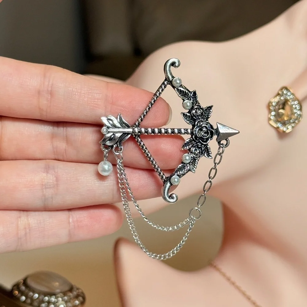 Elegant Silver Bow and Arrow Brooch